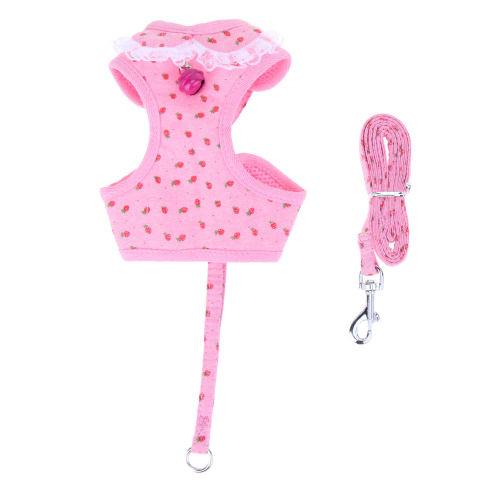 Pink dog harness and leash set with strawberry pattern on a white background