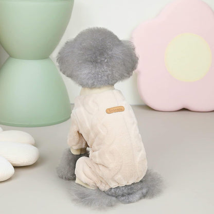 Dog toy with gray hair and beige body on a light surface