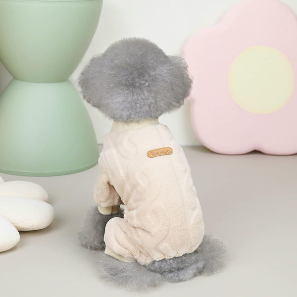 Dog toy with gray hair and beige body on a light surface