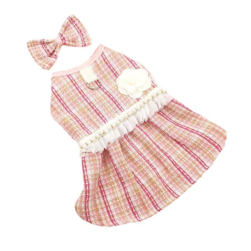Dog dress with ruffles and a matching headband on a white background