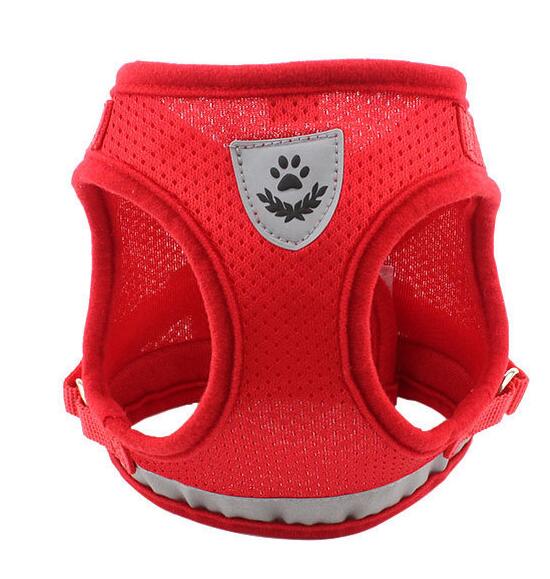 Red dog harness with a gray paw print patch on a white background